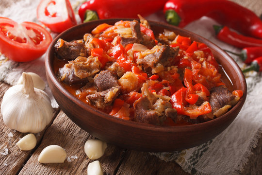 Oriental cuisine: lamb slow stewed with vegetables in a bowl close-up. horizontal
