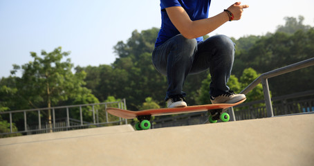 Fototapeta na wymiar skateboarder practice ollie at skatepark ramp