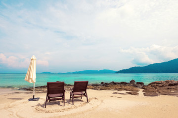 Fototapeta na wymiar The beach with two chairs. Beach vacation. Beach holiday