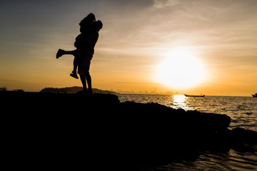 Couple glad to be at the beach. During the summer
