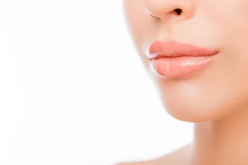 Poster Close-up woman's lips with natural make up on white background © deagreez