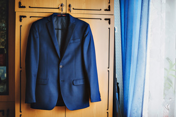 Dark blue in a small checkered formal men suit jacket.