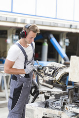 young metallurgist working