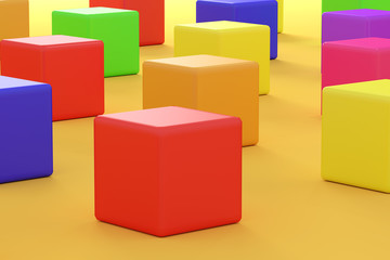 Colorful bright cubes on orange background