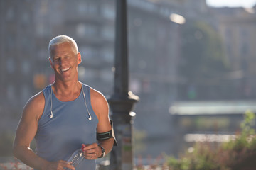 portrait of handsome senior jogging man