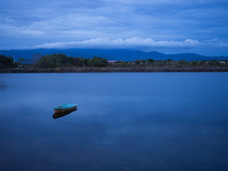 lonely boat lake with bluesky