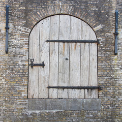 Old wooden door in a wall