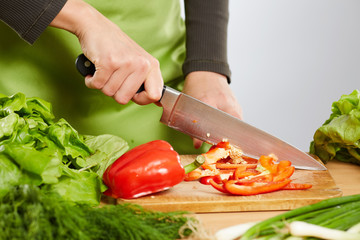 Woman hands chopping vegetables