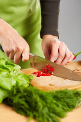 Woman hands chopping vegetables