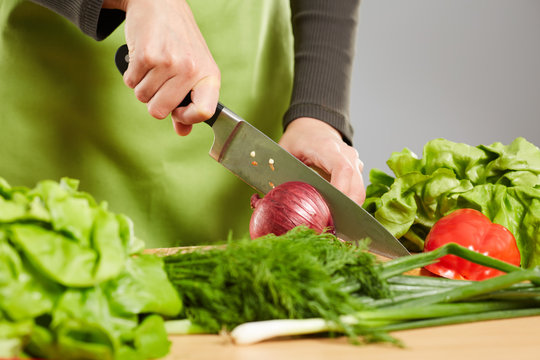 Woman hands chopping vegetables