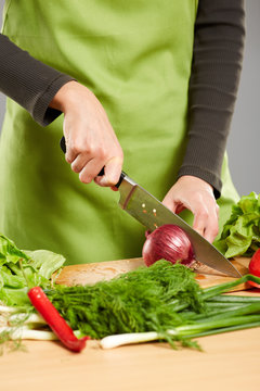 Woman hands chopping vegetables