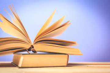 Vintage old books on wooden deck table