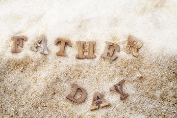 Happy father day concept, word of wooden father day on wood on beach background idea