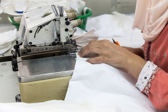 Industrial sewing machines with sewing machine operator