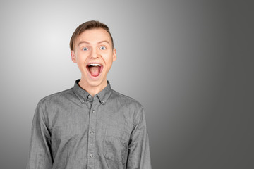 Portrait of young man with shocked facial expression