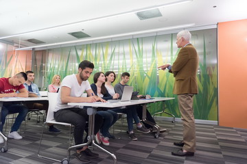 teacher with a group of students in classroom