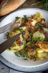 Fried potato with onion and parsley