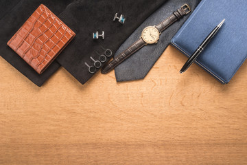 Men accessories on wooden background 