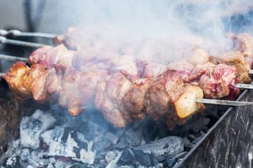 Grilling the marinated pork meat delicious shashlik
