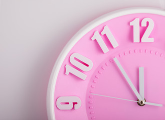 Obraz na płótnie Canvas pink clock face closeup