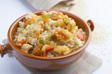 High-key image of white plate with quinoa lentil salad and bowl