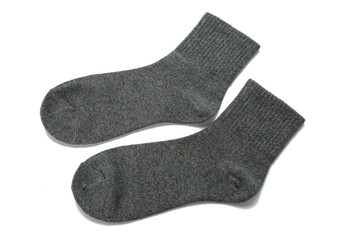 Pair of gray socks on white background