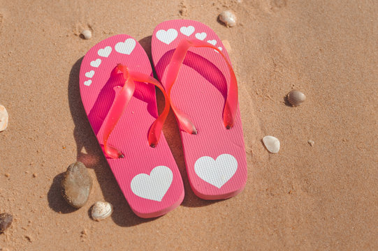 Tropical holiday of flipflops on sandy ocean beach vacation concept