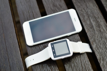 Hand smart watch phone, wooden surface outside background, Top view mock up