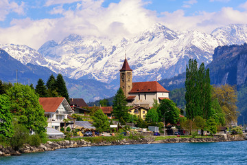 Brienz town near Interlaken and snow covered Alps mountains, Switzerland - obrazy, fototapety, plakaty