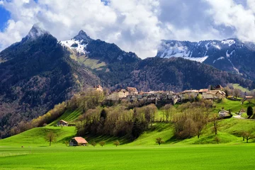 Fotobehang Gruyeres medieval town, Alps mountains, Switzerland © Boris Stroujko