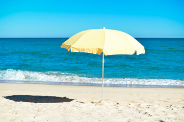 Umbrella on stunning tropical beach background vacation 