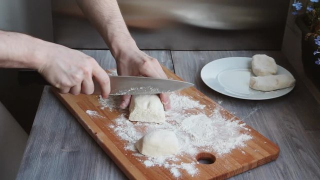 Young chef preparing bakery on a wooden board