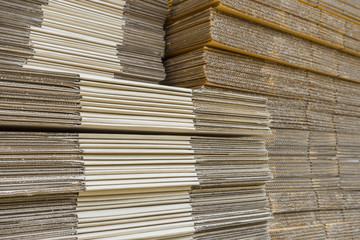 stack of corrugated cardboard boxes. egde view of flattened boxe