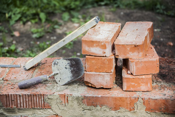 bricks trowel and tools still life on the theme of construction