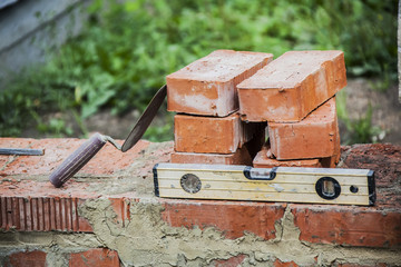 bricks trowel and tools still life on the theme of construction