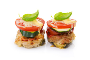 Fried mincemeat baked chops with vegetables and cheese.
