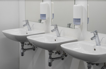  White washbasins in the bathroom. Toilet, WC.