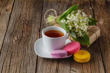 Tea cup with White flower decoration on wooden table