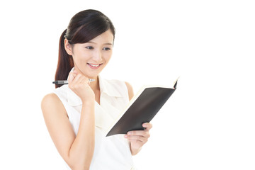 Fototapeta premium スケジュールを確認する女性