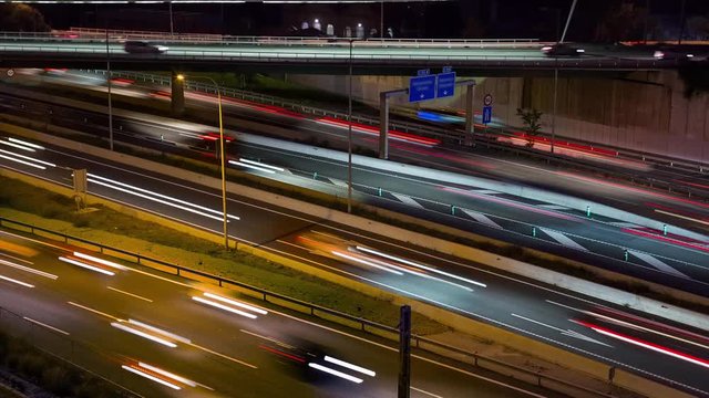 Cinemagraph: night road traffic with bridge in side view cars with moving and all other static cars.Time Lapse. Trail effect