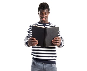Handsome black man reading book