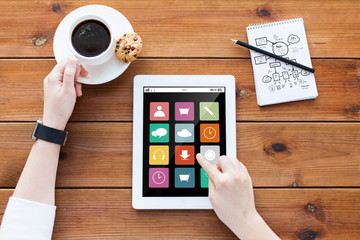 close up of woman with menu icons on tablet pc