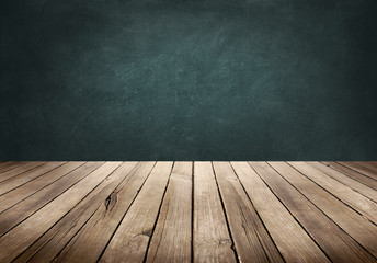 Wood plank table with blackboard background
