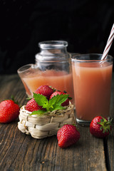 Strawberries and fresh juice with a sprig of mint
