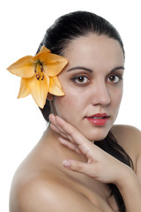 Fototapeta premium beautiful woman with flower on her ear