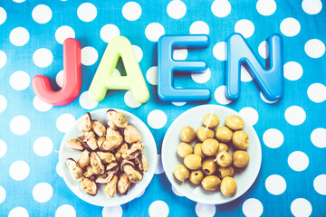 Jaen made of plastic letters, blue dotted background