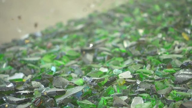 Sorting cullet. Glass recicling. Renewable production. Super slow motion