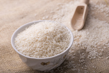 rice and rice grain on jute cloth. jasmine rice. jasmine rice an