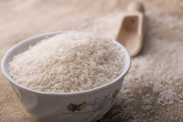 rice and rice grain on jute cloth. jasmine rice. jasmine rice an