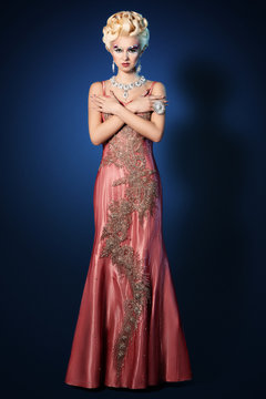 Beautiful woman make up hair style luxury pink dress
